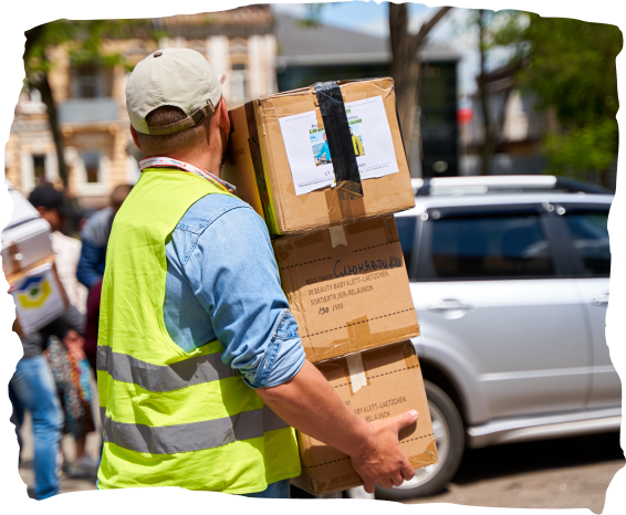 Man carrying aid boxes